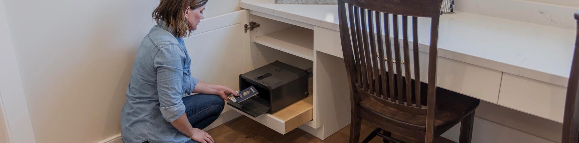 Woman Opening Liberty Safe Handgun Vault in Office